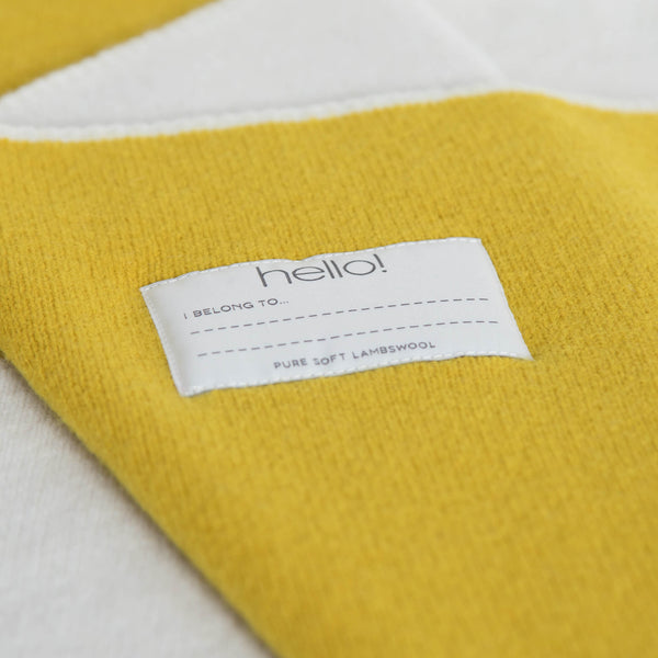 tullibee knitted blanket YAY mustard hello label close up