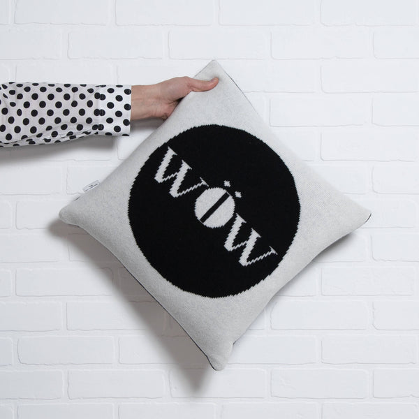 tullibee knitted cushion WOW black holding