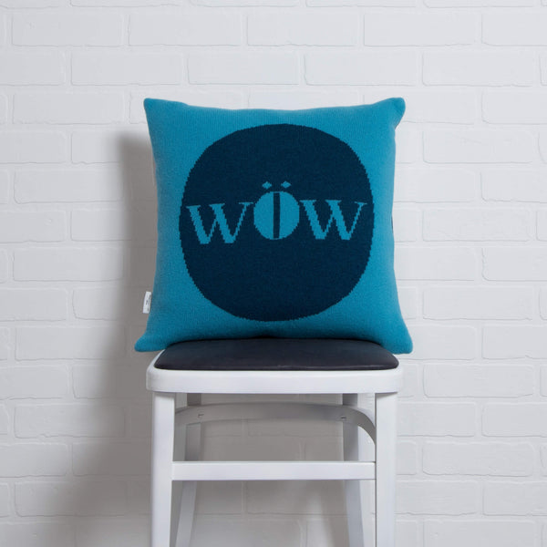 tullibee knitted cushion WOW blue on chair
