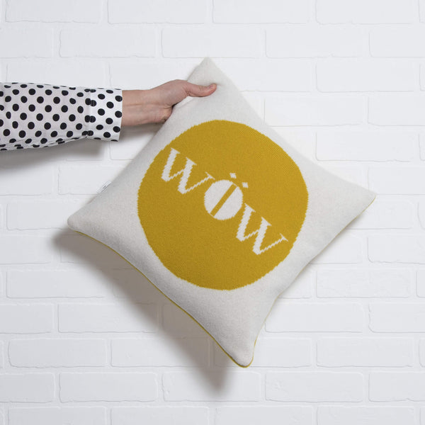 tullibee knitted cushion WOW mustard holding