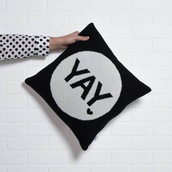 tullibee knitted cushion YAY black holding