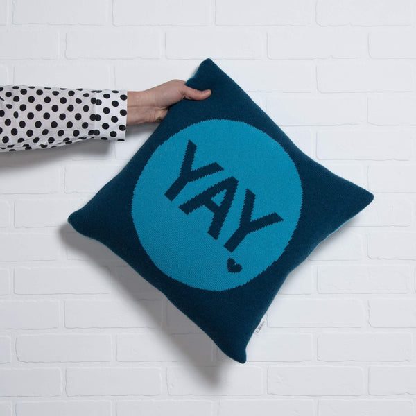 tullibee knitted cushion YAY blue holding