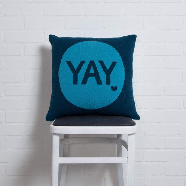 tullibee knitted cushion YAY blue on chair
