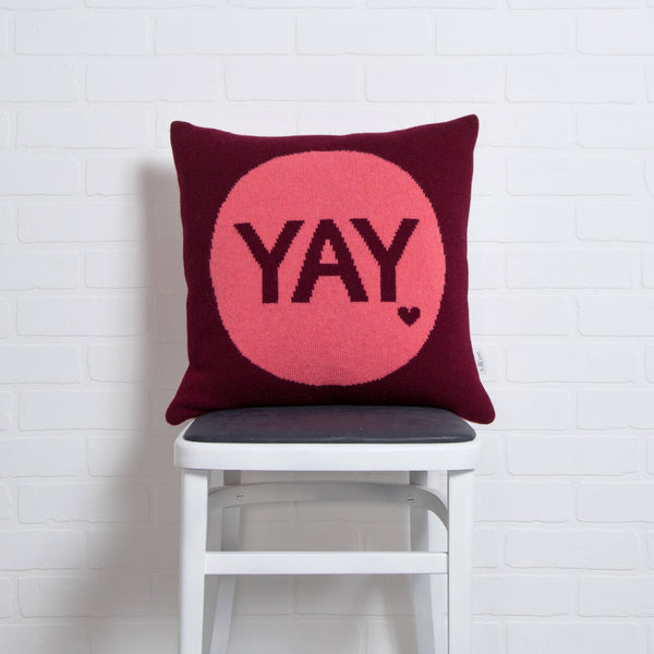 tullibee knitted cushion YAY pink on chair