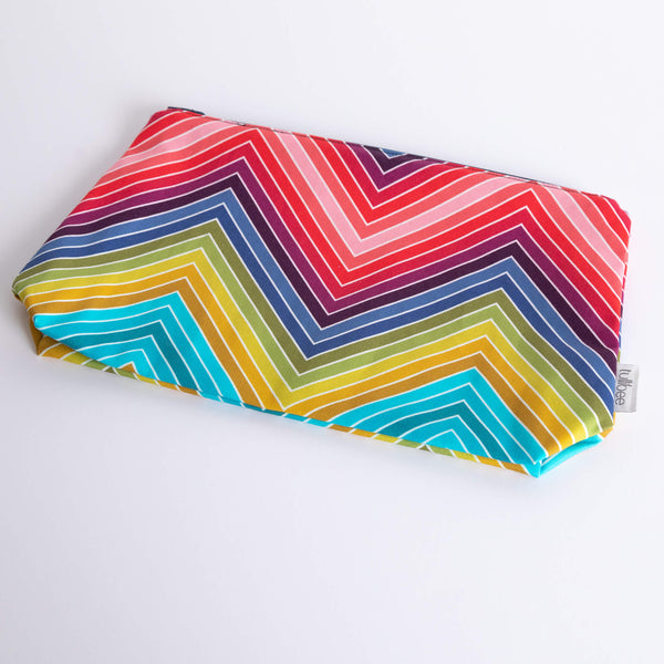 tullibee marni rainbow zig-zag maxi pouch flat at an angle on a white surface