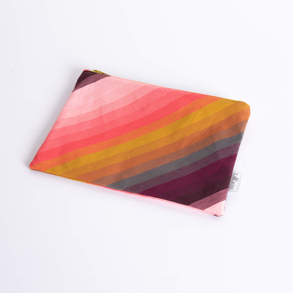 tullibee agnes tonal diagonal stripe midi rectangular pouch at an angle flat on a white surface