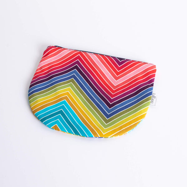 tullibee marni rainbow zig-zag midi round pouch at an angle flat on a white surface