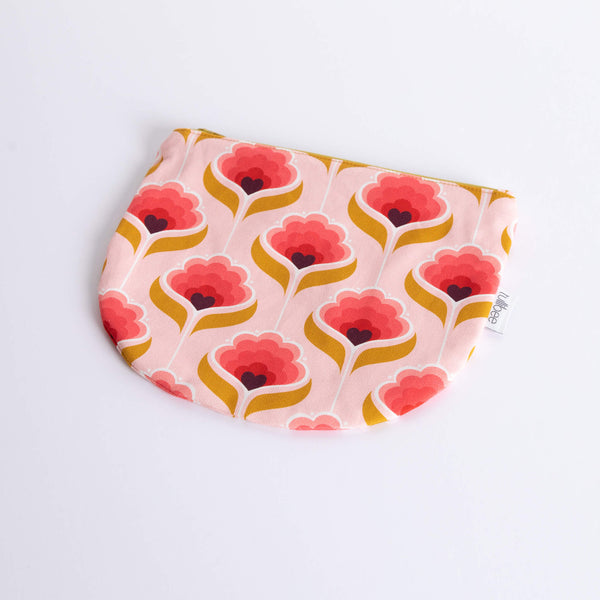 tullibee mini margot retro floral midi round pouch at an angle flat on a white surface