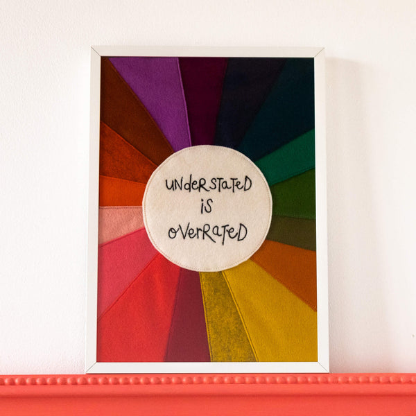 'UNDERSTATED IS OVERRATED' RAINBOW TEXTILE ARTWORK