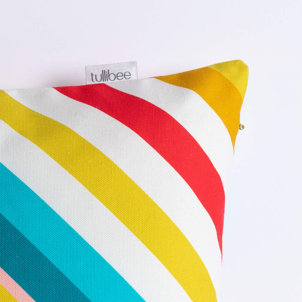 close up of tullibee brand label on side of milo retro diagonal varying width stripe cushion