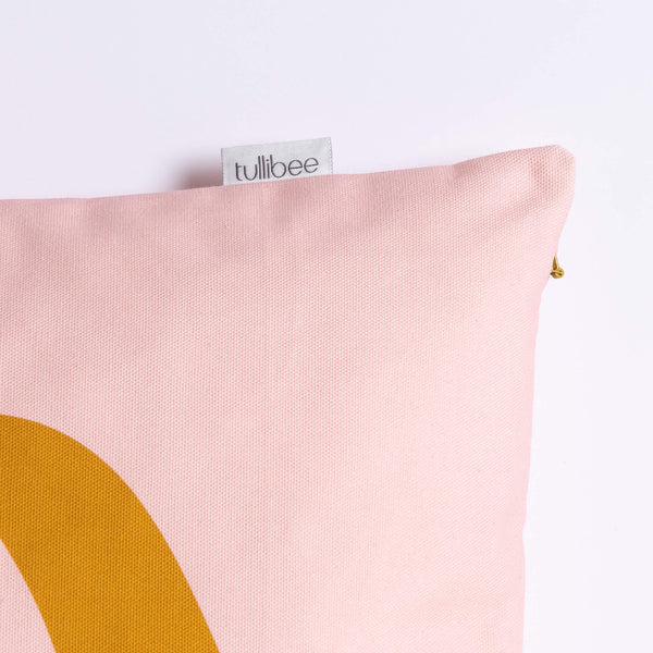 close up of tullibee brand label on side of margot in the middle large retro floral cushion