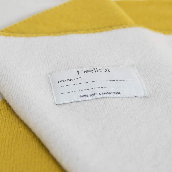 tullibee knitted blanket WOW mustard hello label close up