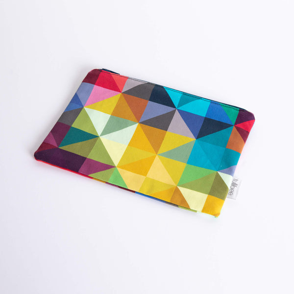 tullibee jules rainbow geometric triangle midi rectangular pouch at an angle flat on a white surface