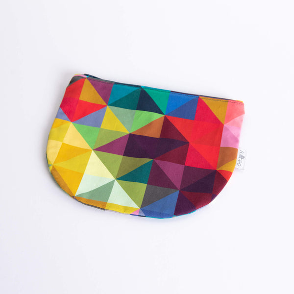 tullibee jules rainbow geometric triangle midi round pouch at an angle flat on a white surface
